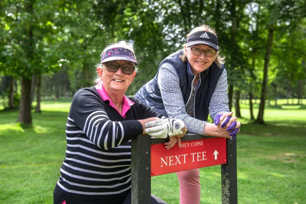 ladies posing on the short course in woking at hoebridge golf club