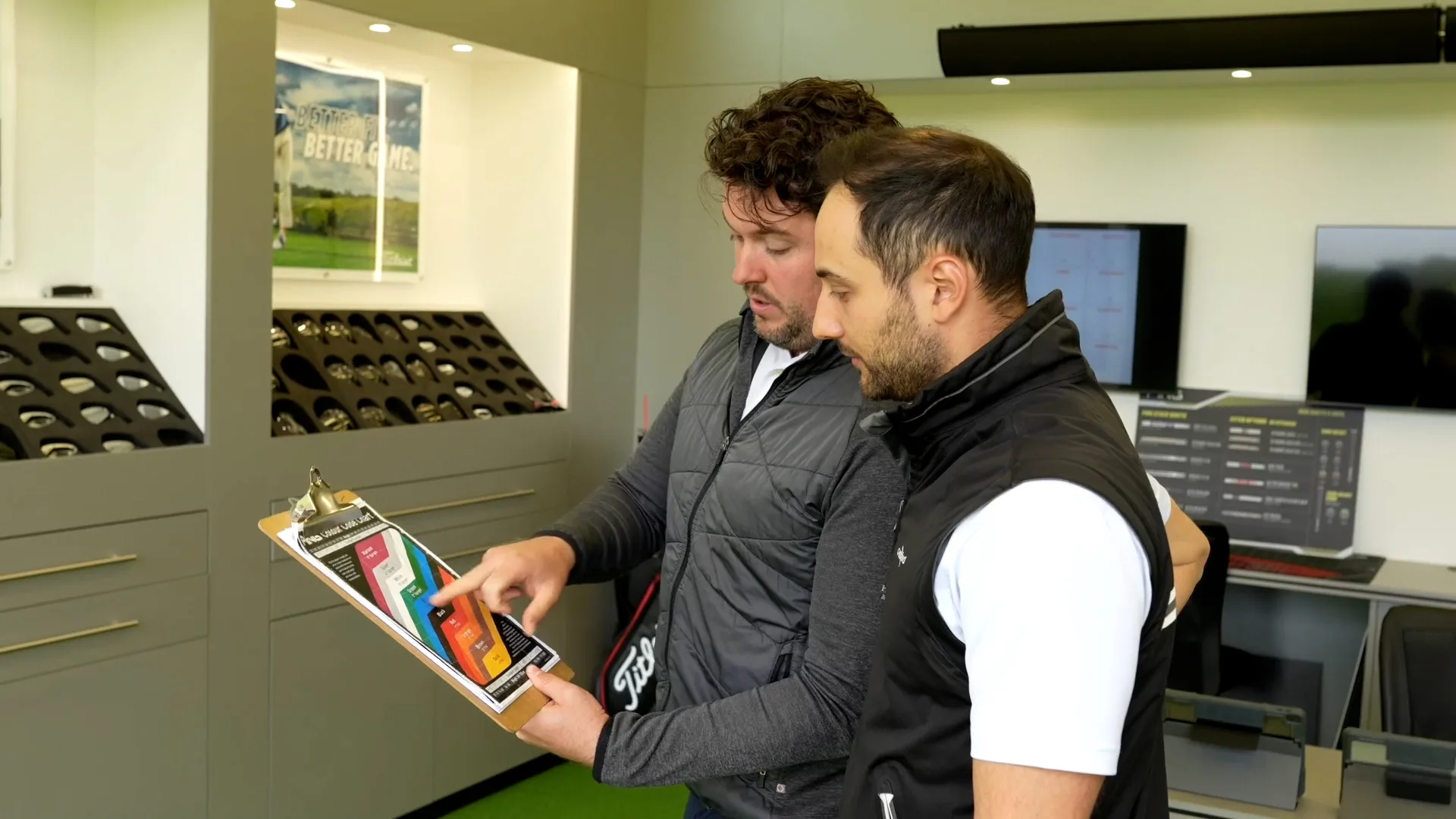 man getting advice during a custom fitting session in woking