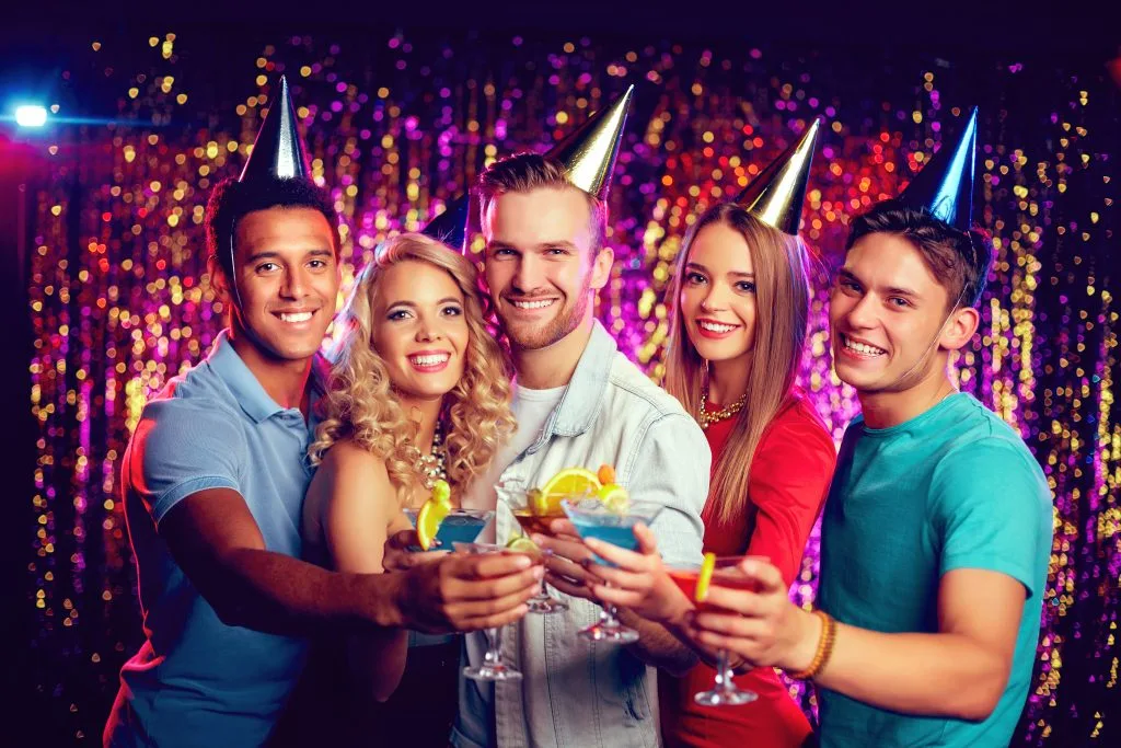 young people at a party venue in woking celebrating with drinks